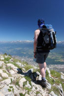 07-2191 Mountaineer on the Summit of Le Moucherotte Above the City of Grenoble Looking East Towards the Alps.